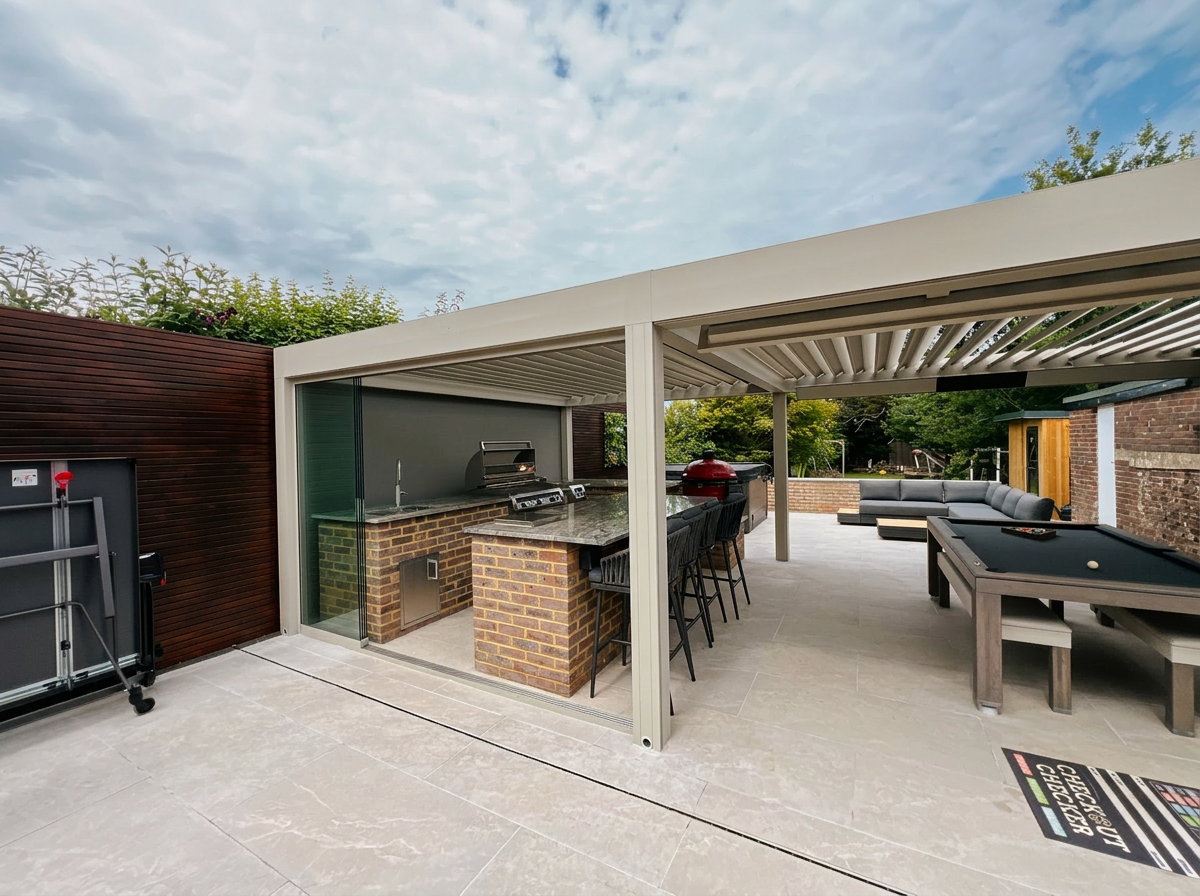 Wide view of the finished family kitchen garden with pergola kitchen, pool table and lounge area