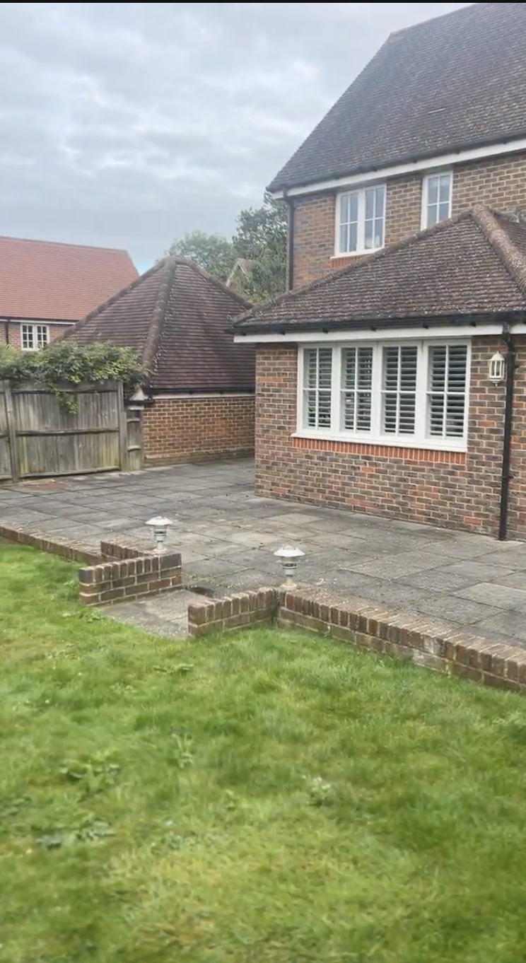 Original Dell garden — patio and raised brick borders before redesign